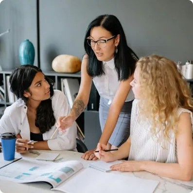 Three women working on a project 