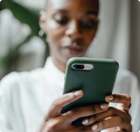 Person typing on her phone